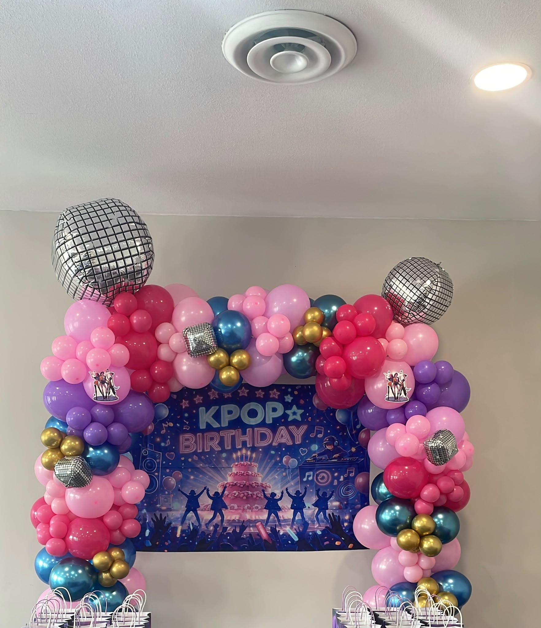 Vibrant pink and purple K-pop birthday balloons with disco balls